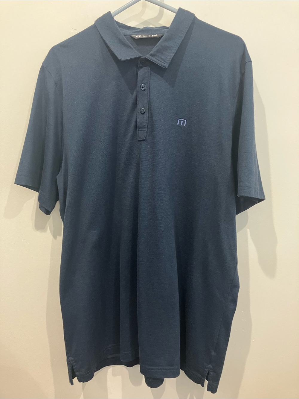 Travis Mathew Navy Blue Polo with Subtle Logo